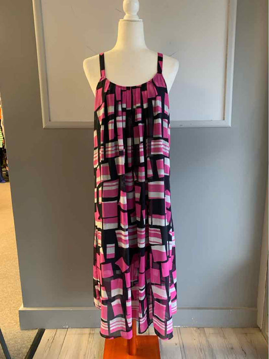 Sleeveless pink and black color block midi dress with square patterns and adjustable straps.
