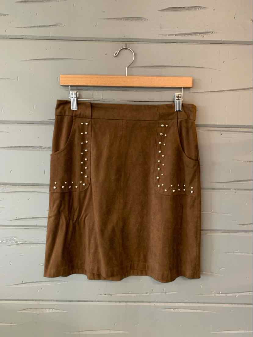 Brown faux suede mini skirt with a straight cut and rows of metallic studs across the front pockets.