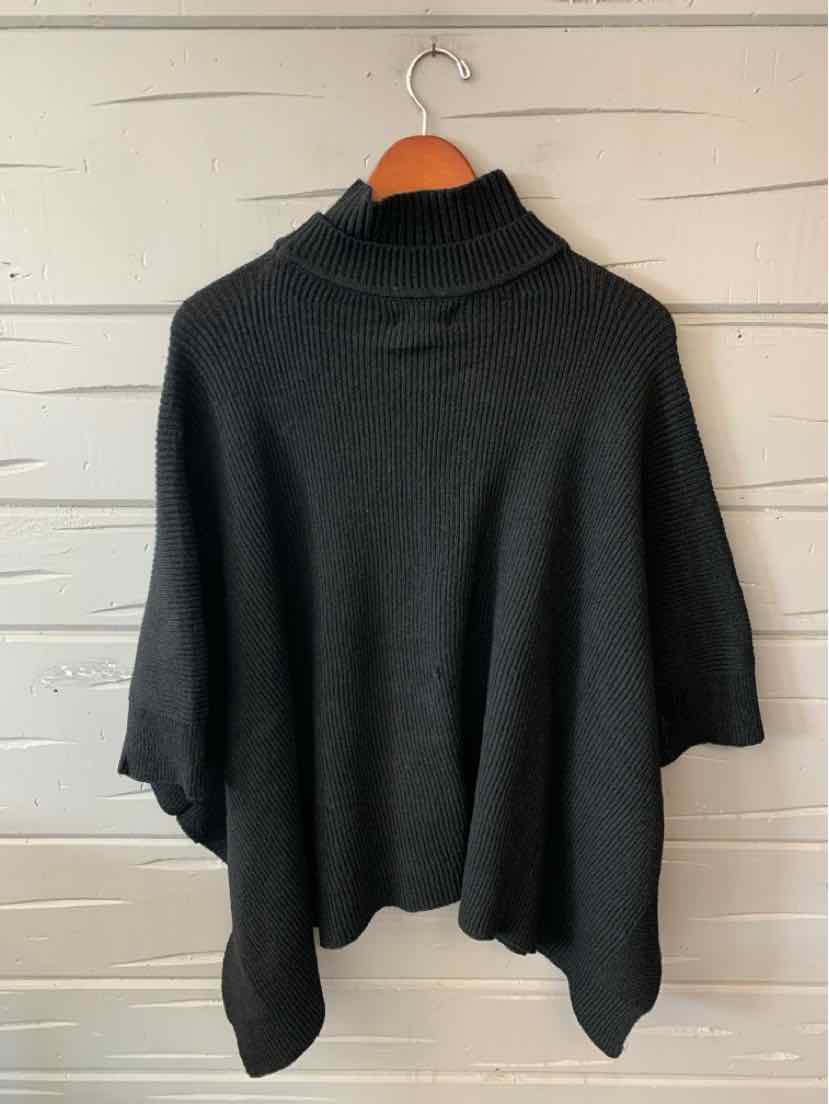 Black BCBG poncho-style sweater with a ribbed turtleneck, short sleeves, and an asymmetrical hem.