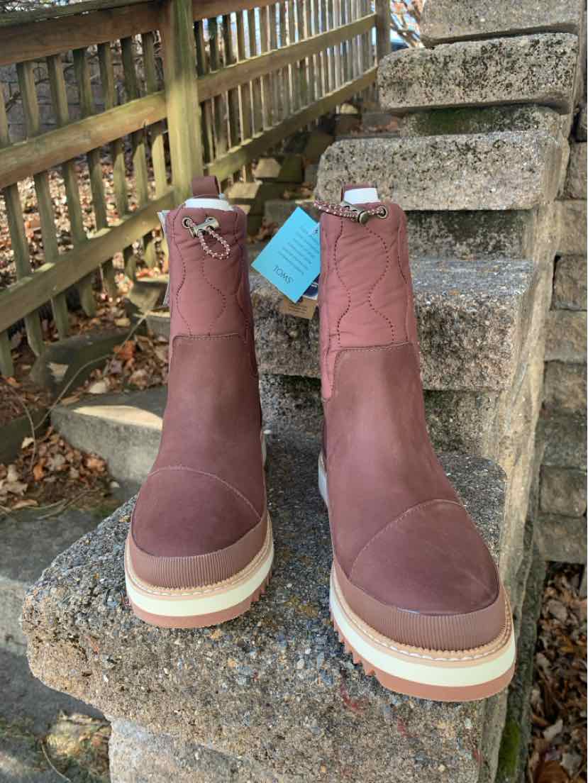 Brown suede TOMS women's boots size 9 with white laces and thick beige soles.