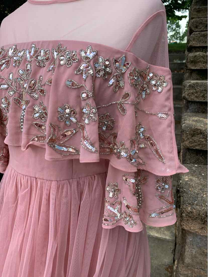 Pink sheer blouse with layered sleeves adorned with intricate beadwork and floral embroidery.
