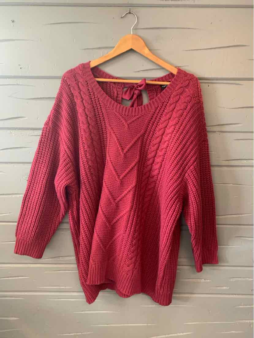 Oversized burgundy knit sweater with chevron pattern and wide v-neck tie-back detail.