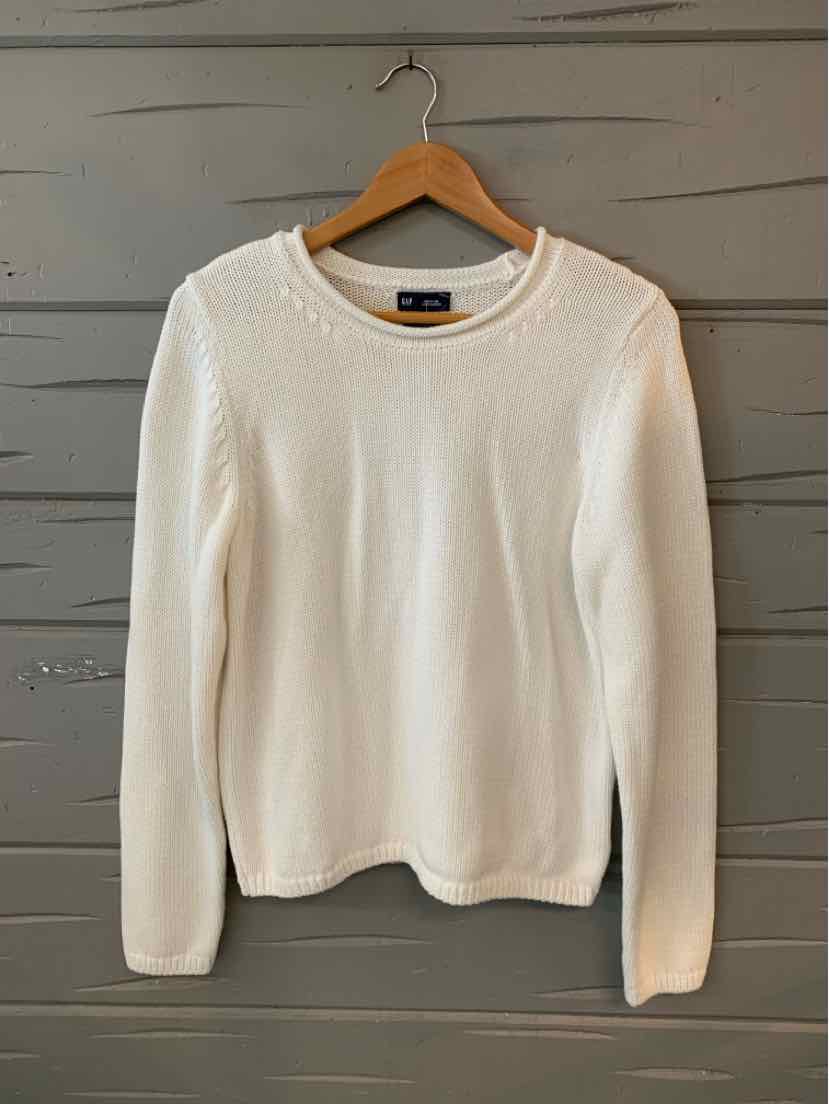 White long-sleeve crewneck sweater with ribbed cuffs and hem, made of soft knit fabric.