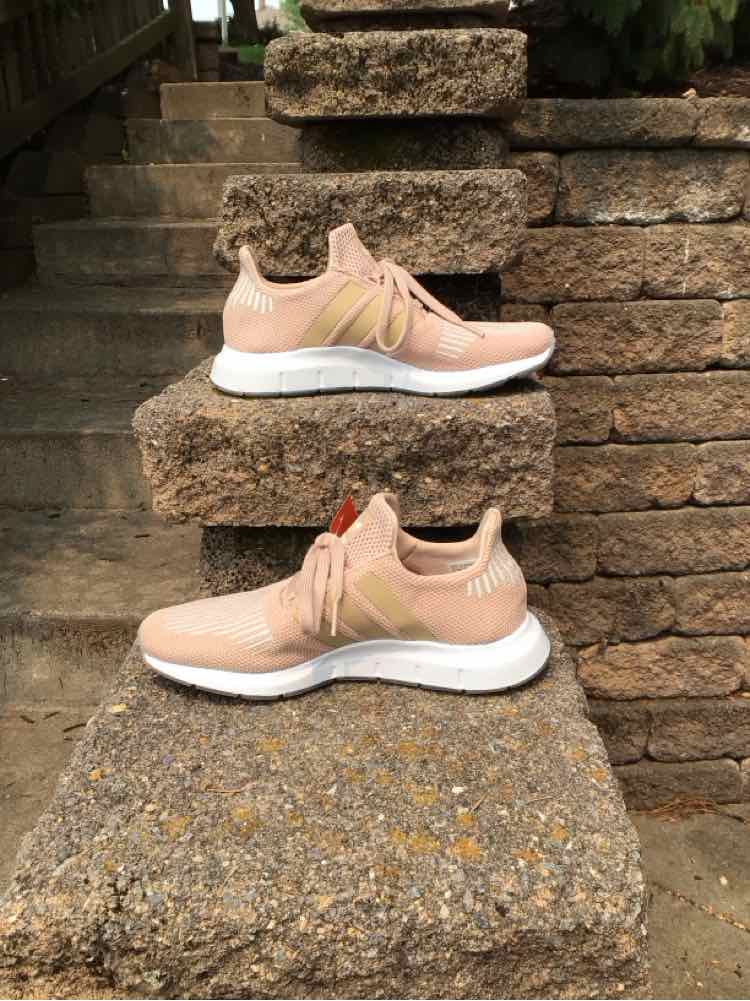 Tan Adidas women's sneaker size 5.5 with white cushioned sole and breathable mesh upper.