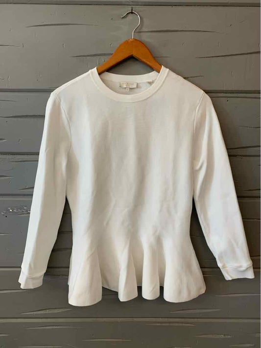 White long-sleeve Ted Baker sweater with peplum hem and crew neckline.