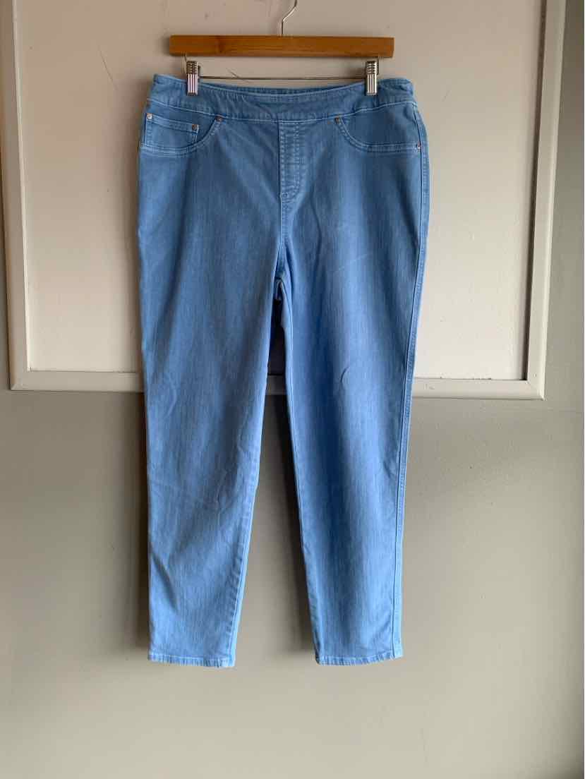 Light blue straight-leg pants with front pockets and button closure on wooden hanger against white door background.