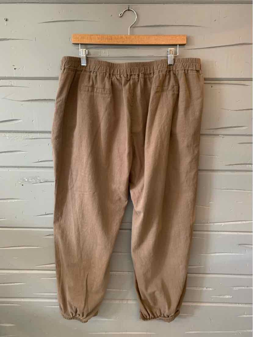 Light brown casual pants with elastic waistband and gathered elastic cuffs, relaxed fit.