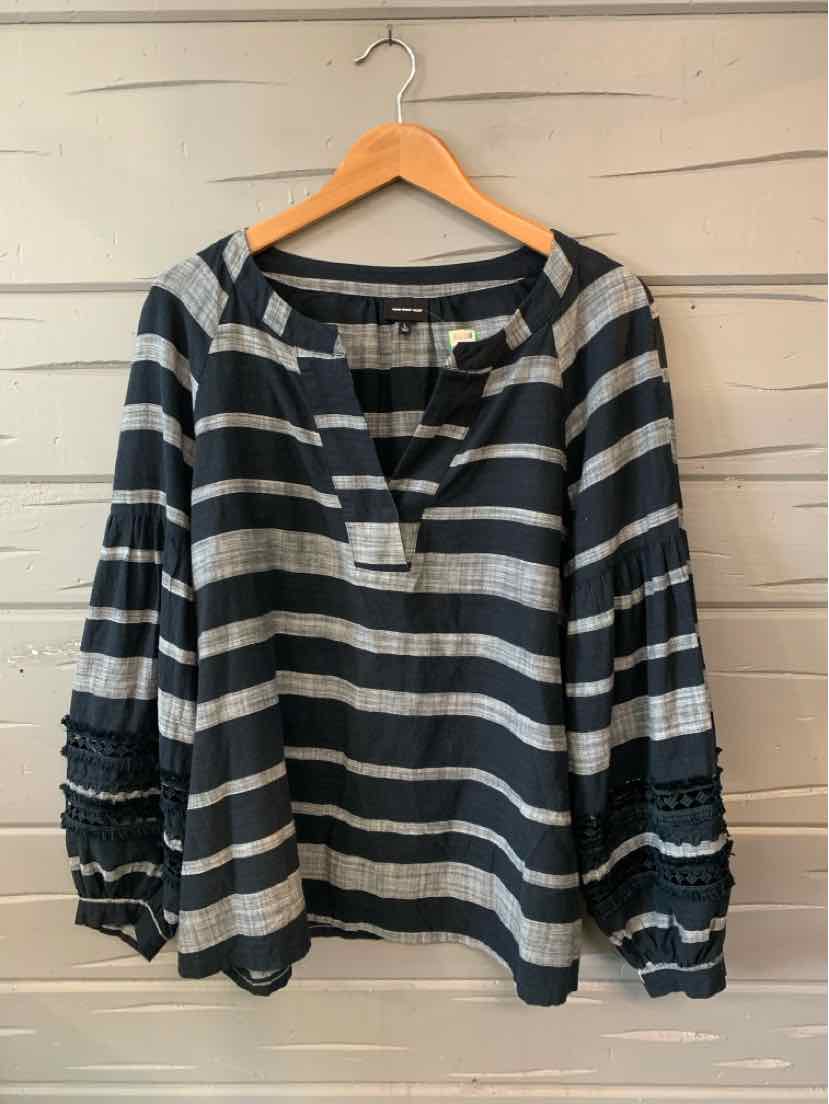 Black and white horizontal striped long-sleeve blouse with textured smocked cuffs and a split neckline.