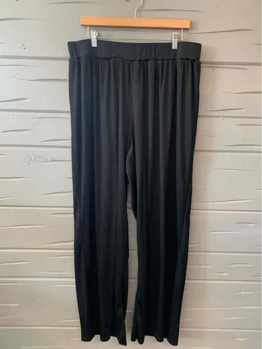 Black relaxed-fit pants with elastic waistband, straight leg cut, and soft lightweight fabric.