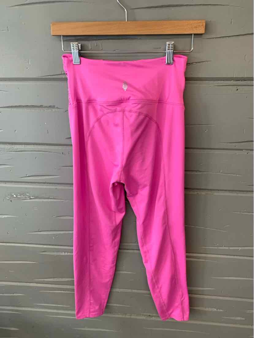 Pink high-waisted leggings with seamless detailing and a small logo on the front waistband.