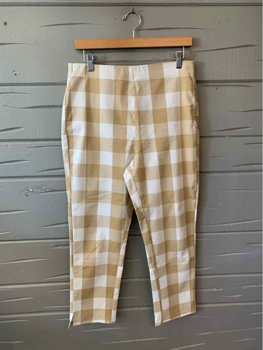 Tan and white gingham-patterned ankle-length pants with a fitted waist and slim legs.