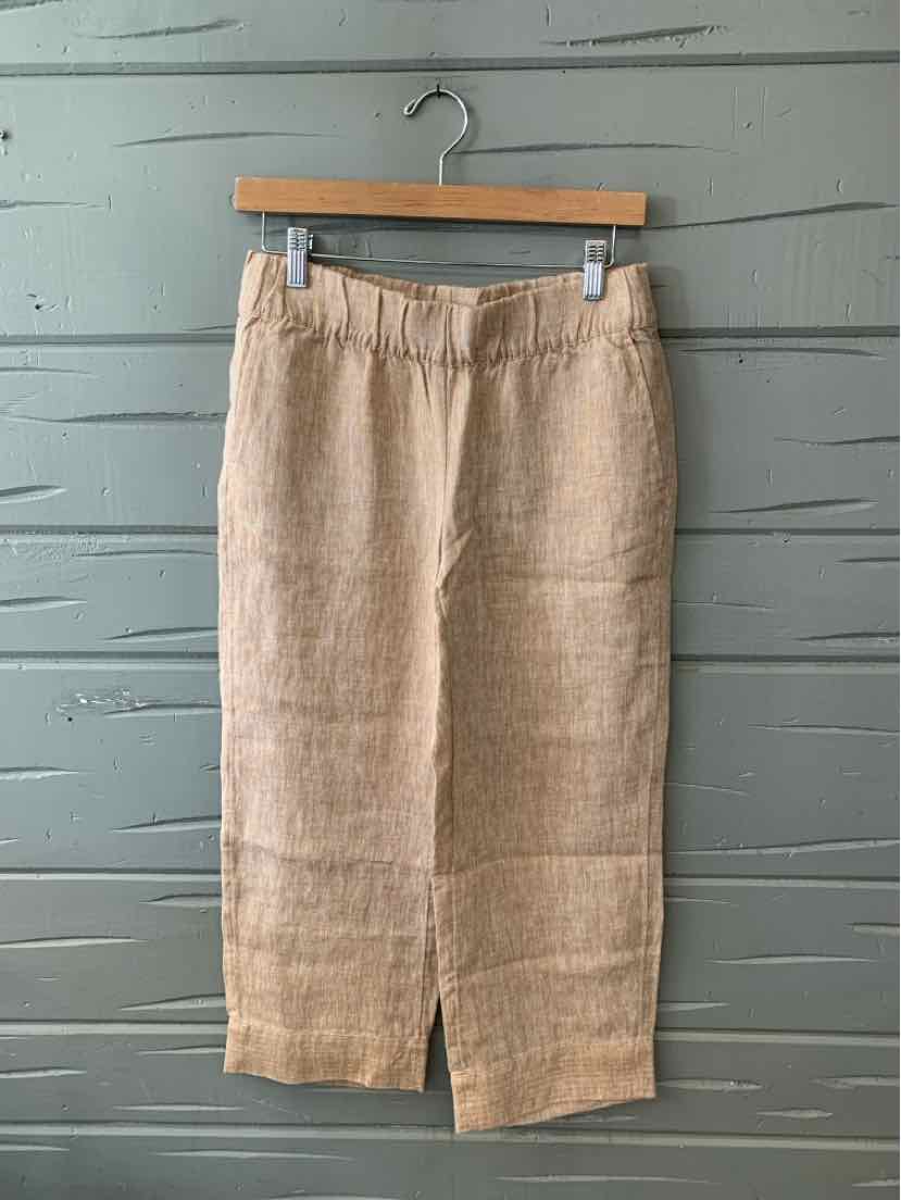 Sand-colored linen midi skirt with front slit and elastic waistband hanging on wooden hanger.