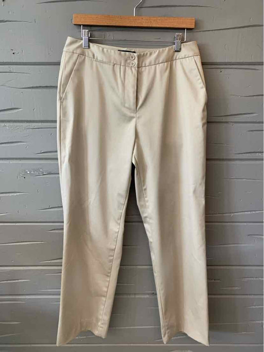 Tan smooth cotton-blend pants with a straight leg and front zipper closure.