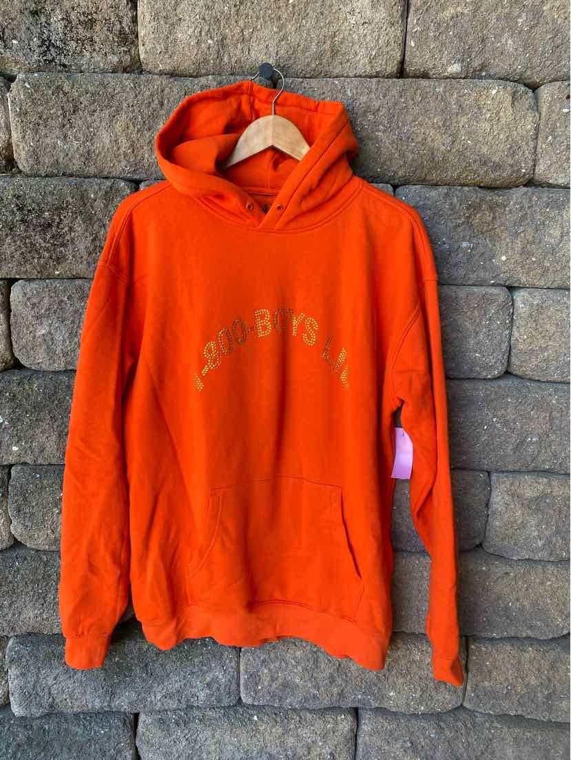 Bright orange pullover hoodie with front kangaroo pocket and "BOYS LIE" text in light yellow across chest.