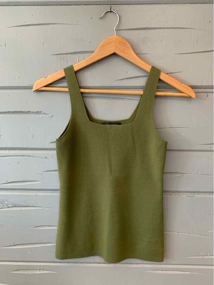 Olive green sleeveless square-neck knit tank top on wooden hanger against gray wall.
