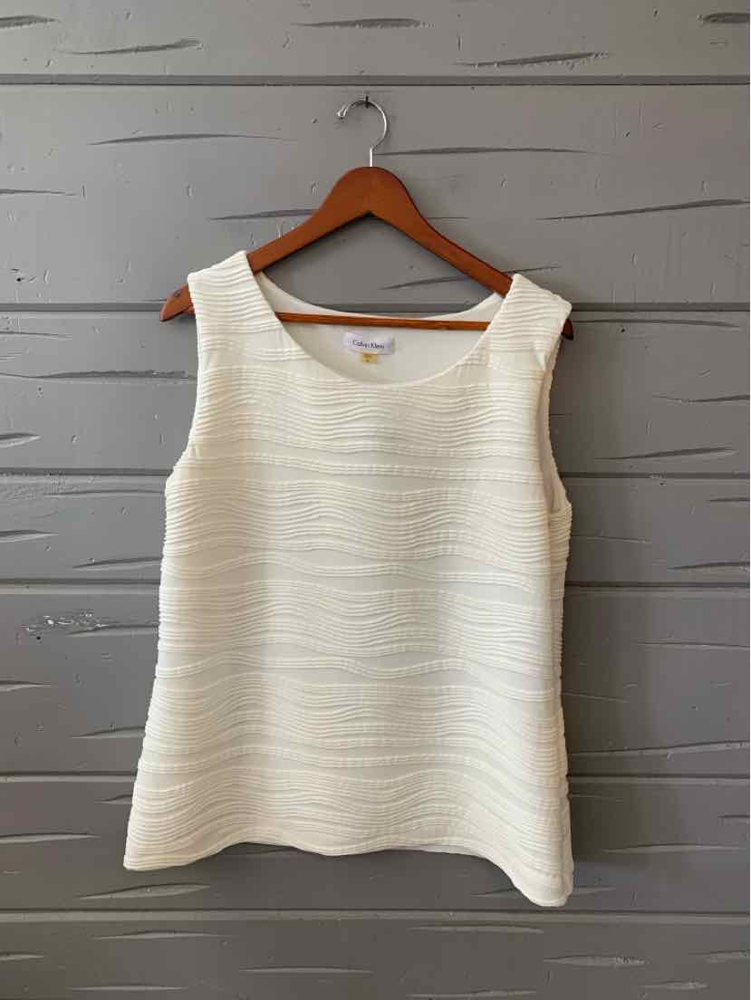 White sleeveless textured knit top with scoop neckline, size XL, on wooden hanger.