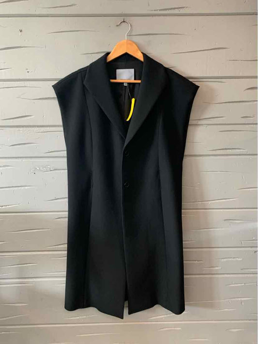 Black sleeveless long vest with wide lapels and structured shoulders on wooden hanger.