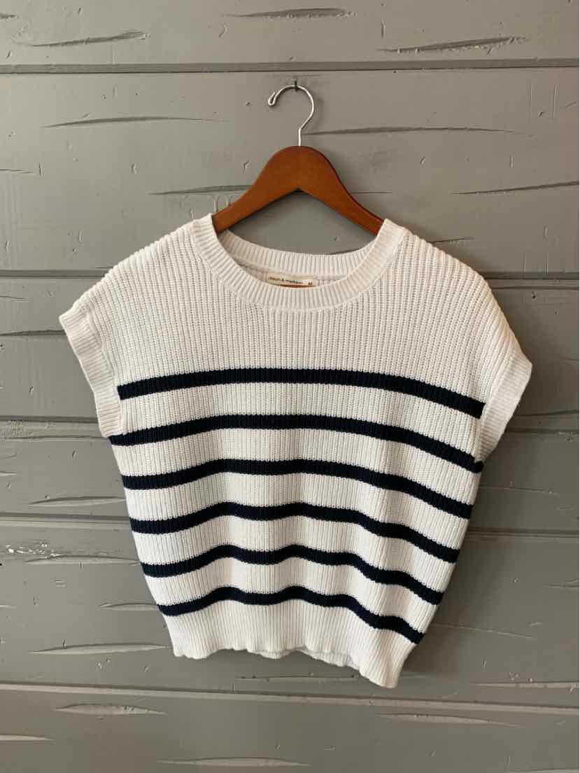 White knit short-sleeve sweater with navy horizontal stripes and ribbed hem on wooden hanger.