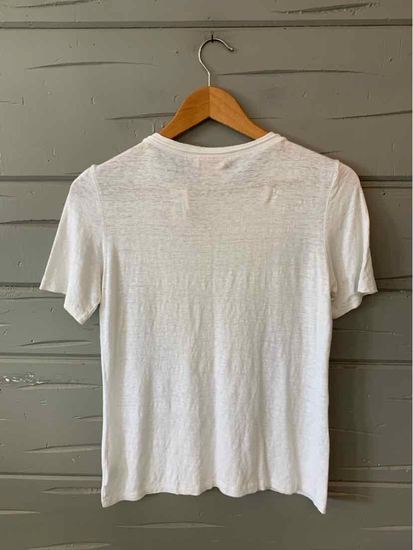 White short-sleeve lightweight crew neck shirt with soft textured fabric on wooden hanger.
