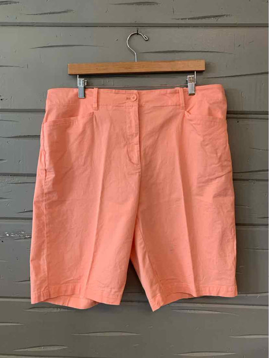 Coral orange knee-length shorts with a front zipper and side pockets, size 16.