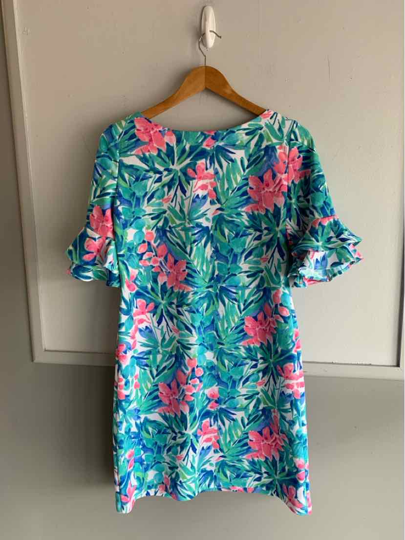 Teal short dress with pink and white floral print, ruffled short sleeves, and a round neckline.