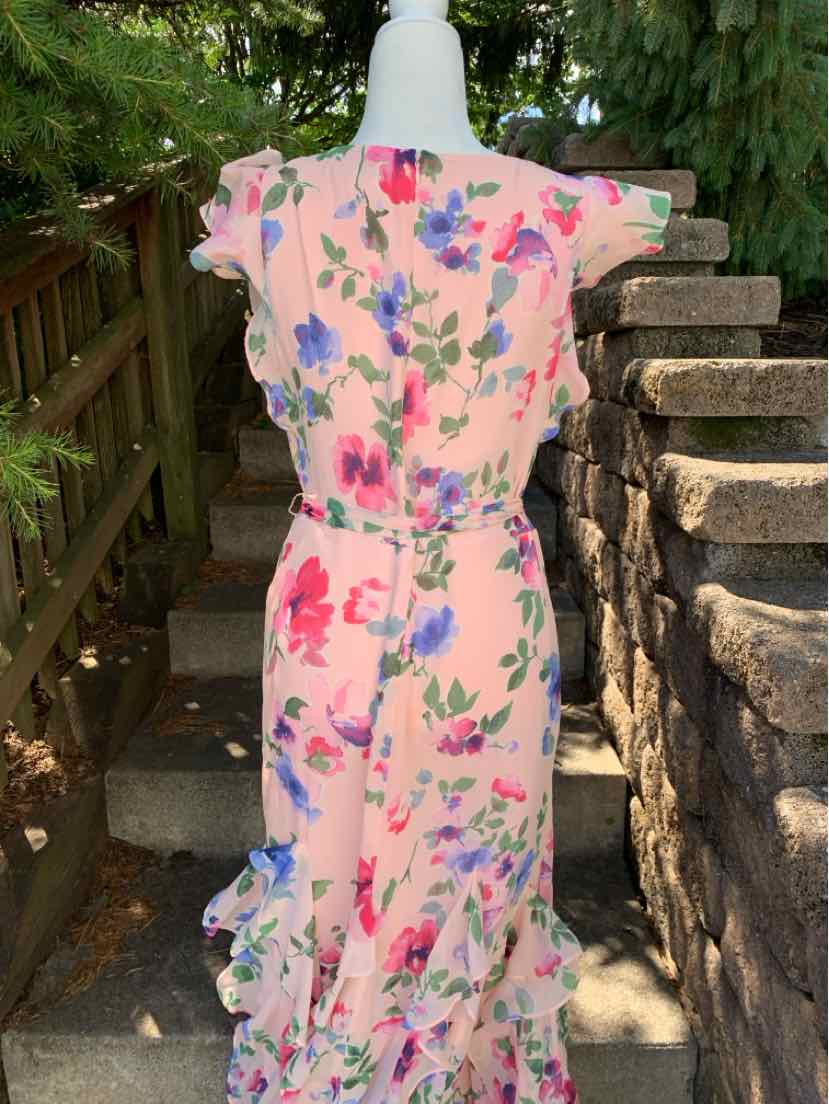 Pink floral dress with short sleeves and ruffle details at the hem in size 10.
