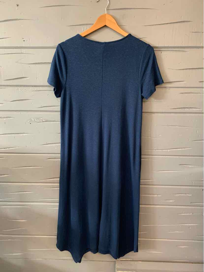 Navy blue short-sleeve midi dress with round neckline and straight silhouette hanging on wooden hanger.