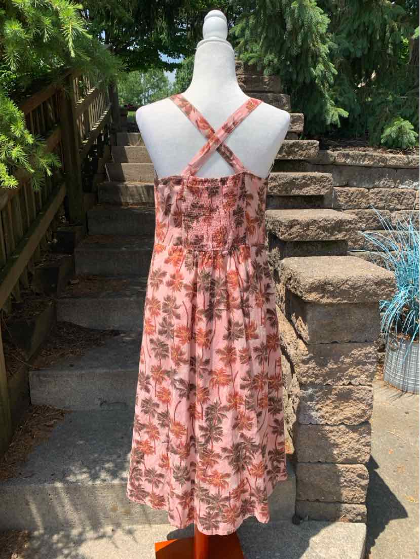 Pink tropical floral midi dress with crisscross straps and smocked back waist.