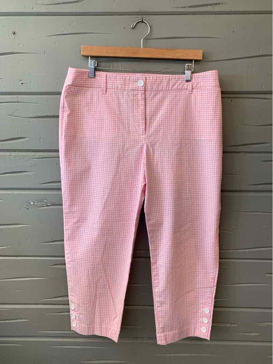 Light pink cropped pants with front buttons and flat front design, size 14.