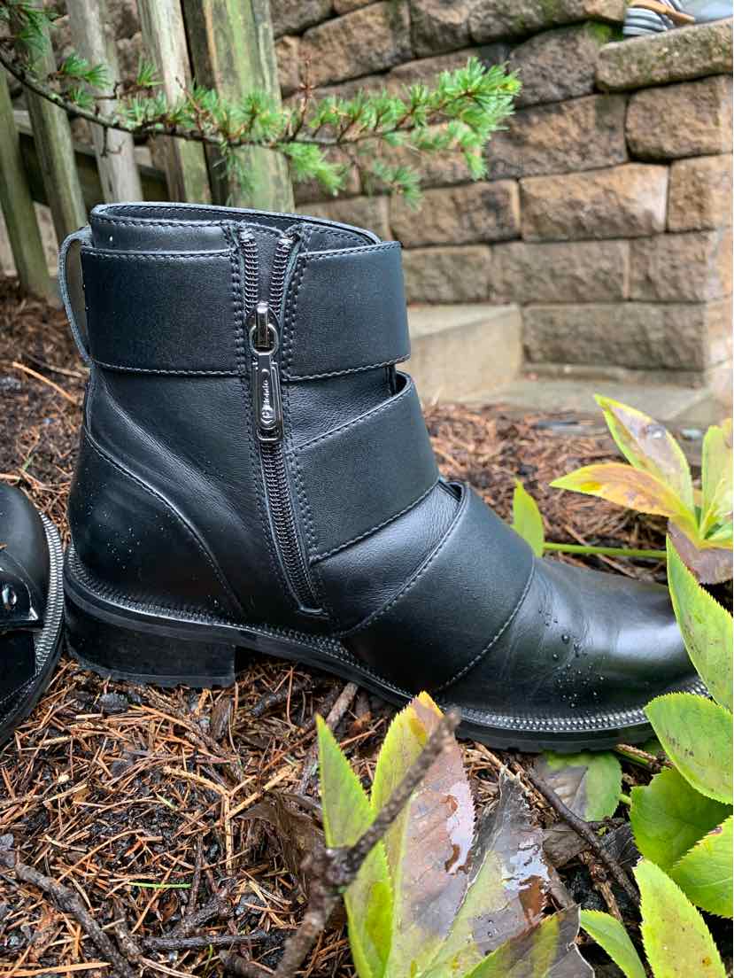 Black leather ankle boot with side zipper, rounded toe, and low chunky heel.