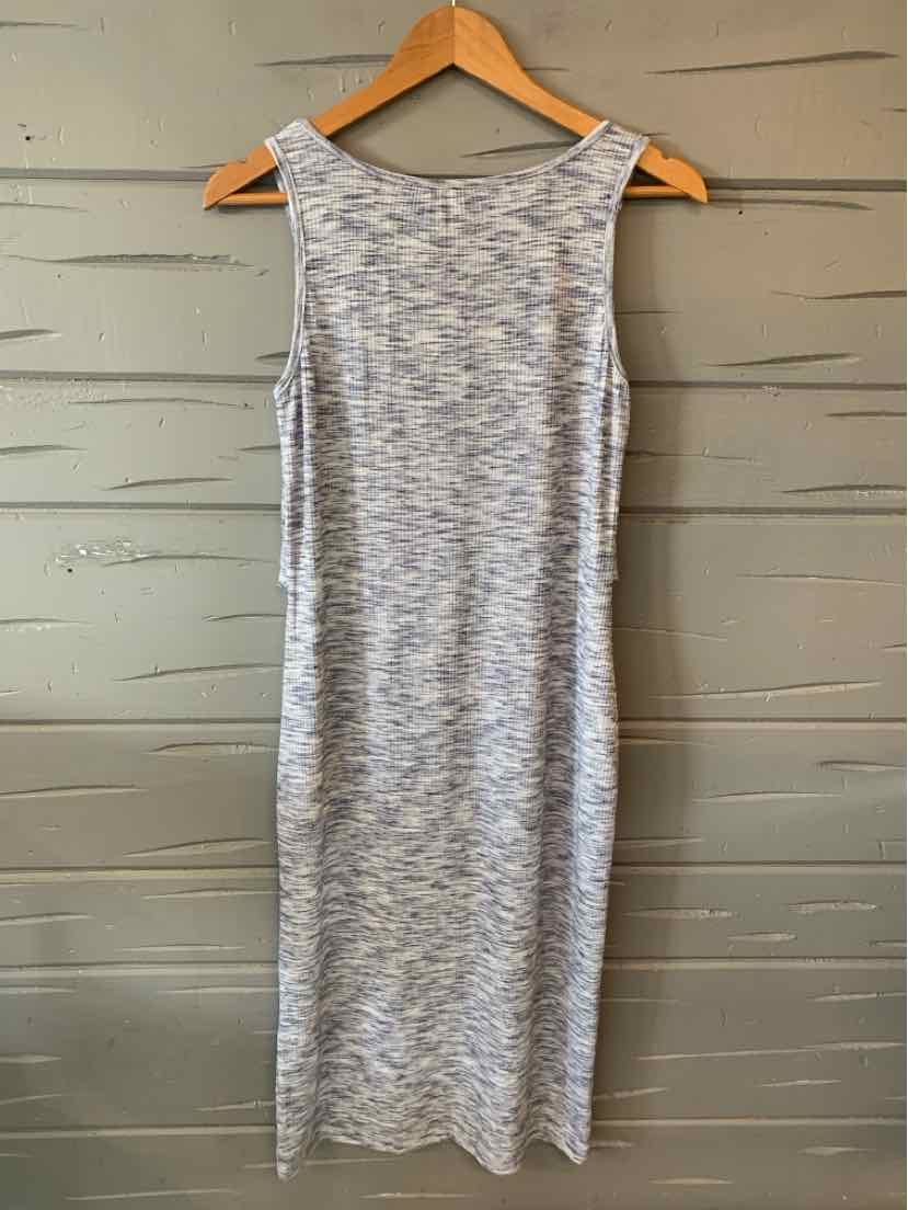 Sleeveless knee-length dress in a textured blue and white knit fabric on a wooden hanger.