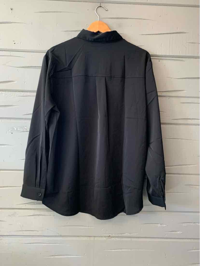 Black long-sleeve button-up shirt with a pointed collar, back yoke, and box pleat.