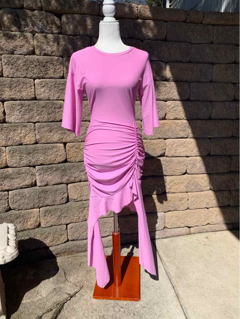 Light purple midi dress with ruched detailing and asymmetrical hem on mannequin.