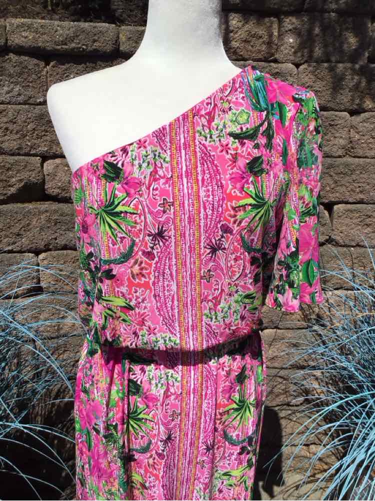 Pink one-shoulder dress with green and black floral print and a fitted waist.