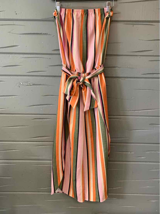 Striped sleeveless jumpsuit in pink, orange, green, and white with a tied waist belt.