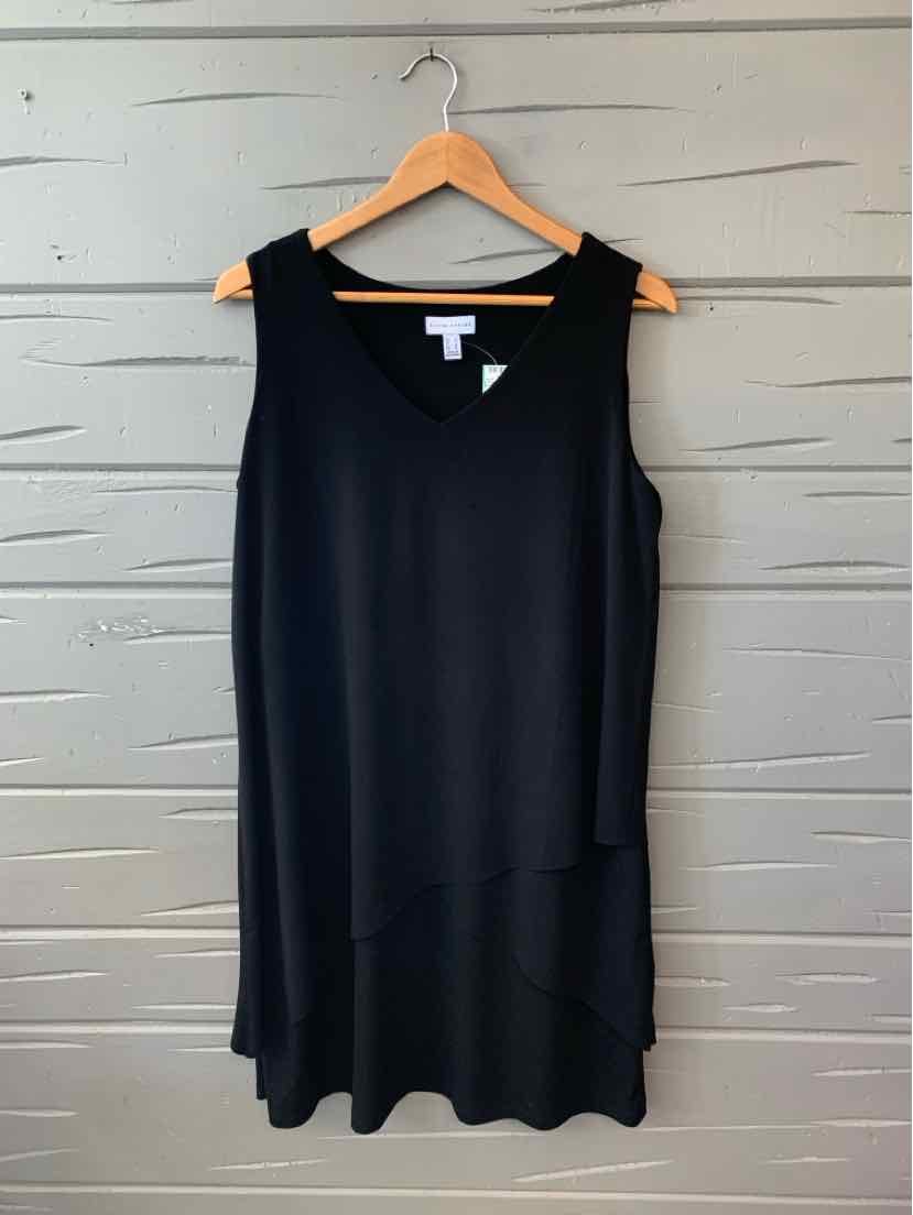 Black sleeveless sleeveless dress with a loose fit and round neckline on wooden hanger.