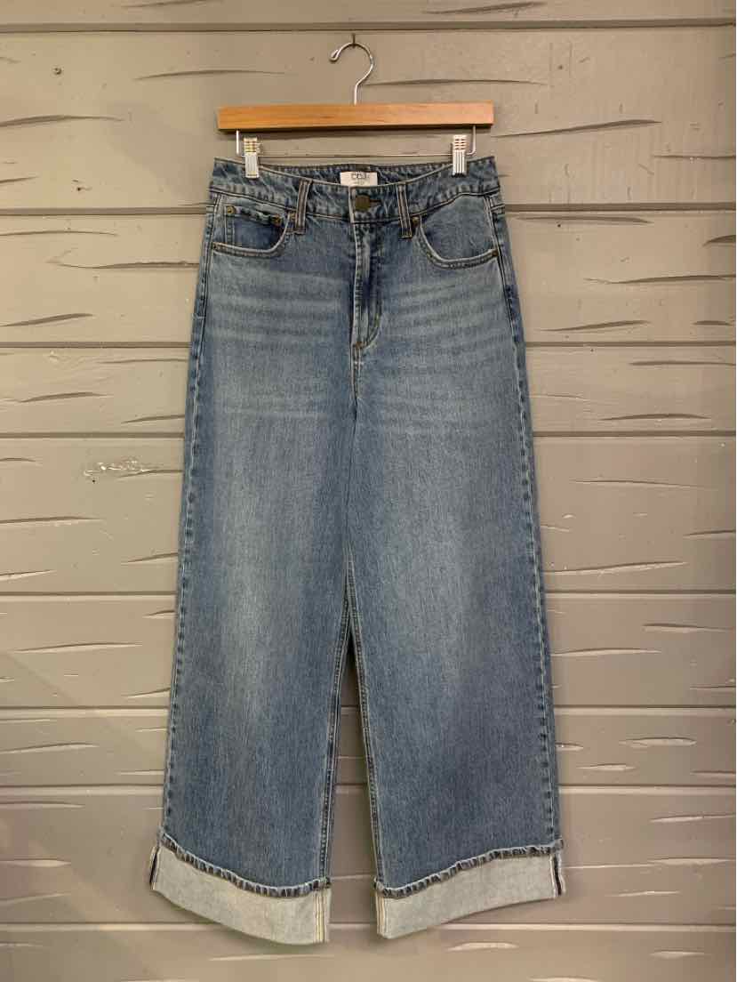 High-waisted wide-leg denim jeans in medium blue wash with cuffed hems and classic five-pocket styling.
