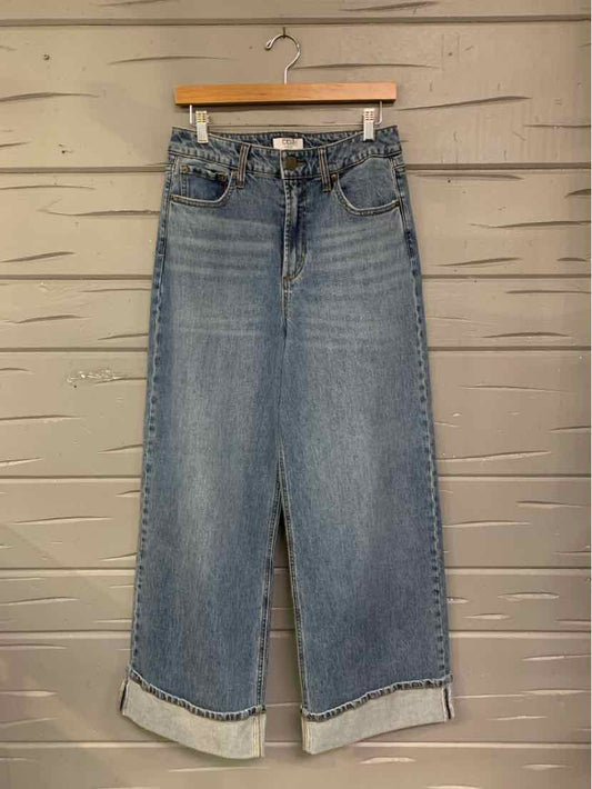 High-waisted wide-leg denim jeans in medium blue wash with cuffed hems and classic five-pocket styling.