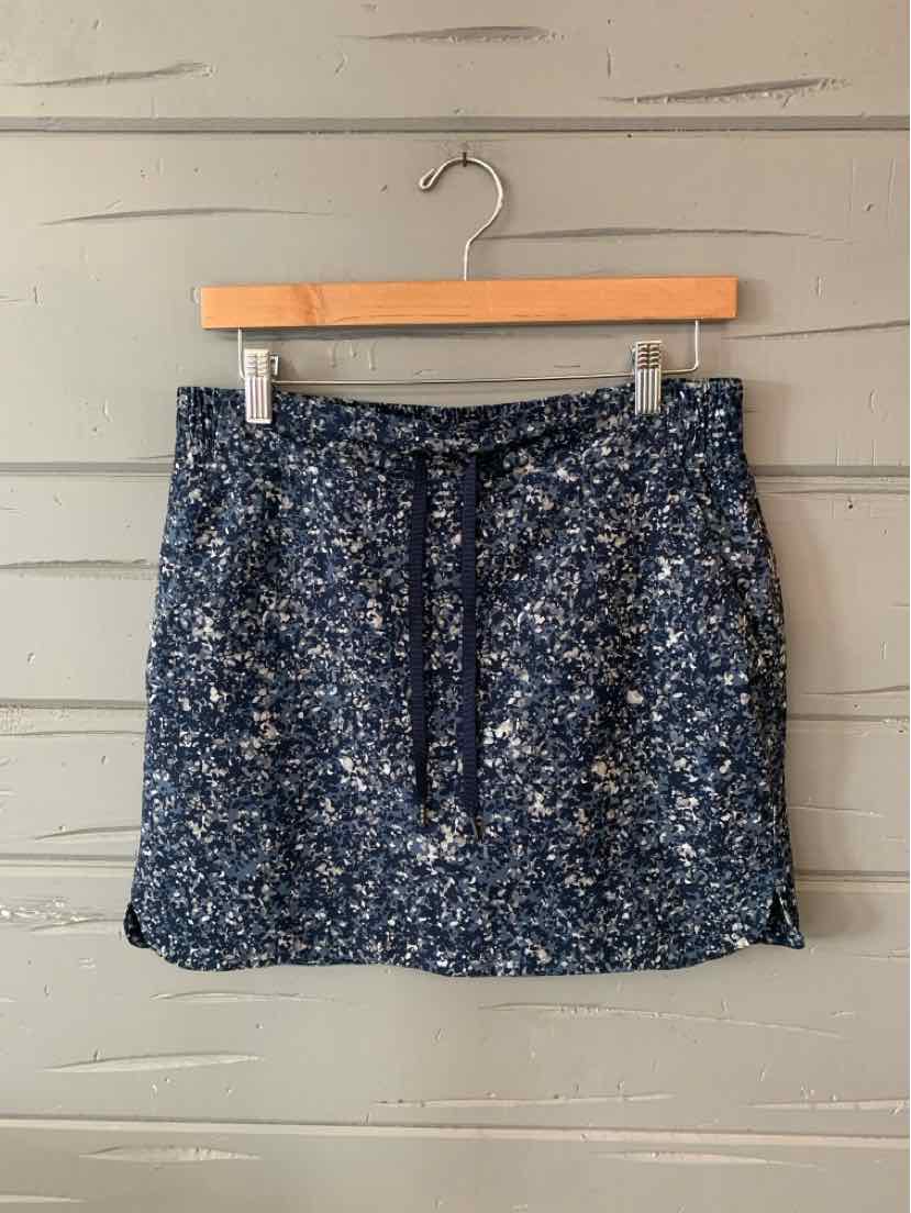 Navy blue floral patterned skirt with adjustable drawstring waist in size 6.