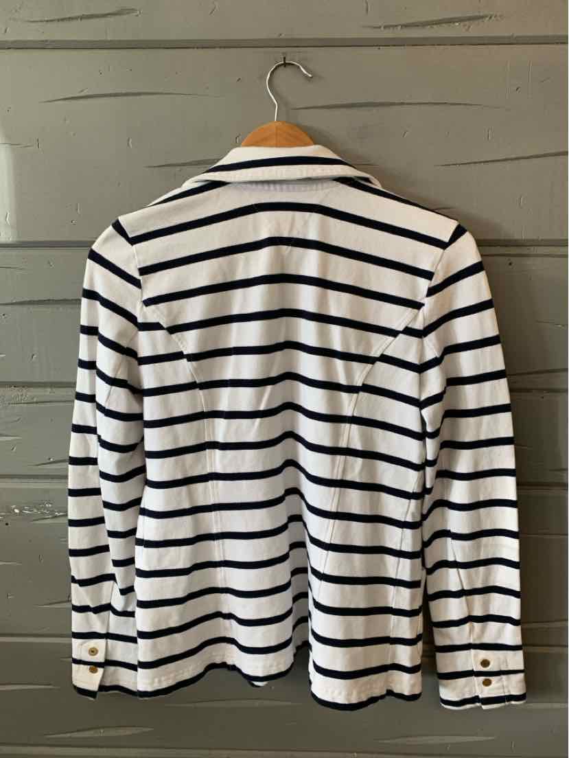 White long-sleeve shirt with black horizontal stripes and buttoned cuffs on wooden hanger.