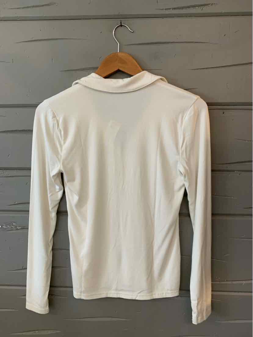 White long-sleeve crew neck shirt with smooth fabric, slim fit, displayed on wooden hanger.