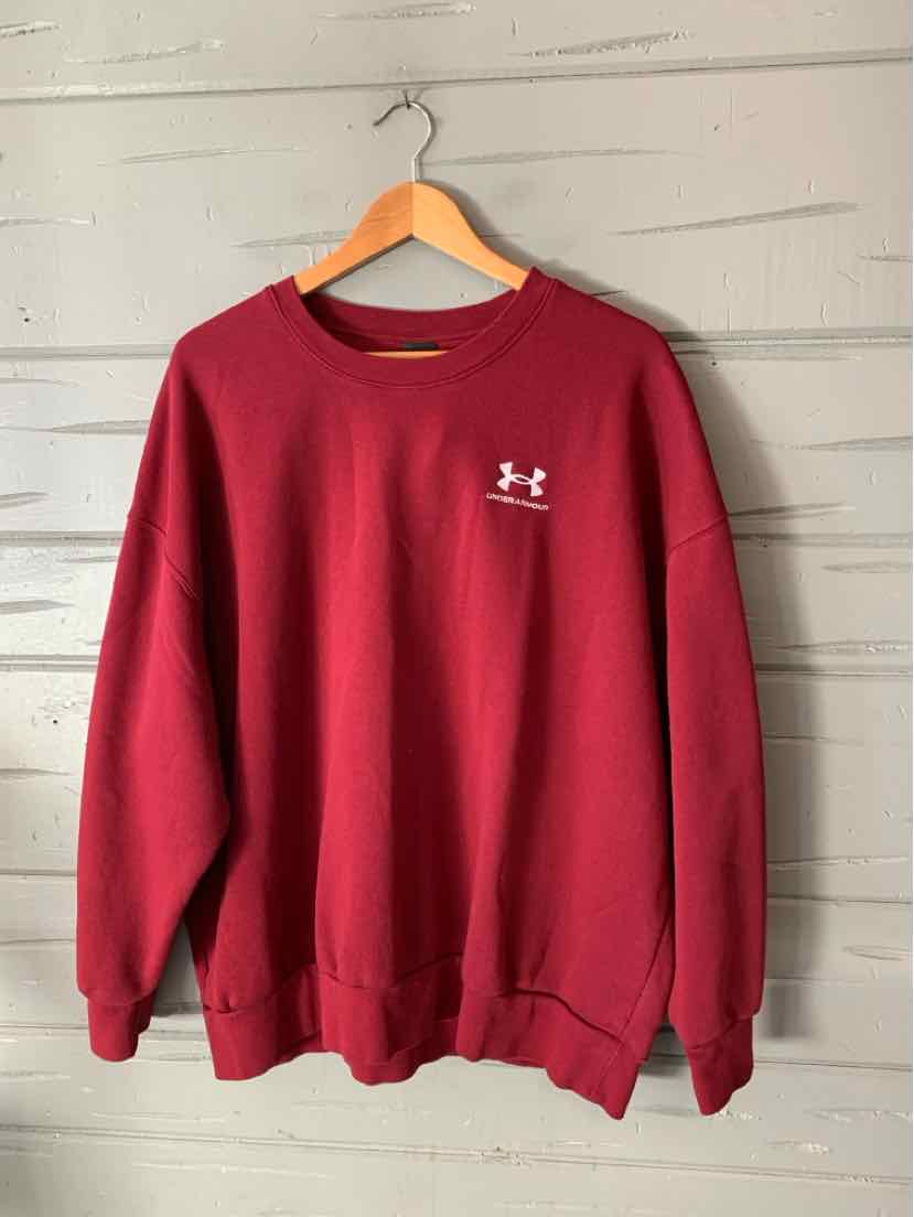 Burgundy Under Armour pullover sweatshirt with a crew neck, ribbed cuffs and hem, and small chest logo.