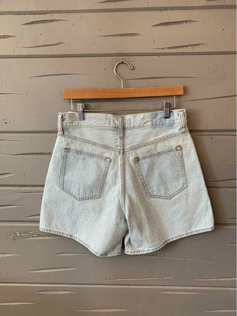 Light wash denim shorts with high waist, two back pockets, and a button closure waistband.