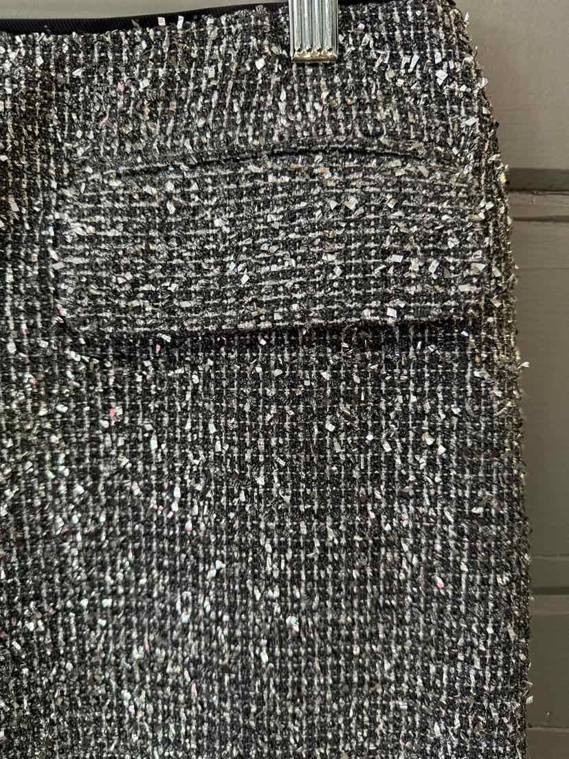 Metallic silver and black tweed skirt with front flap pocket and waistband, size 6.