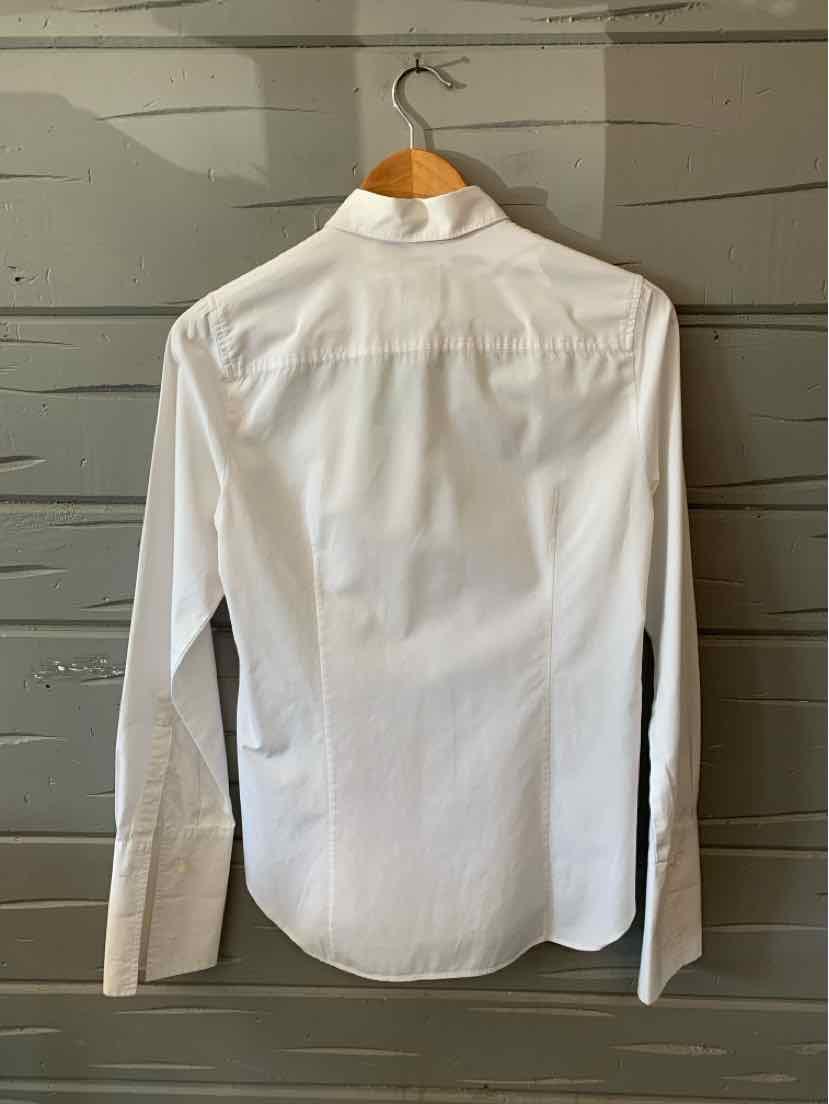 White long-sleeve button-up shirt in size 4 with a classic collar hanging on wooden hanger.