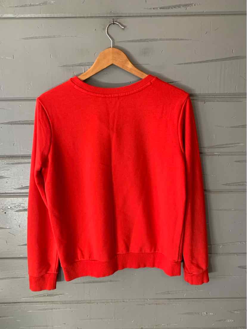 Bright red Adidas crewneck sweatshirt with long sleeves and a relaxed fit, hanging on a wooden hanger.