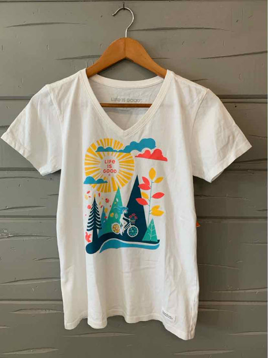 White V-neck T-shirt with colorful outdoor graphic featuring sun, trees, bike, and clouds.