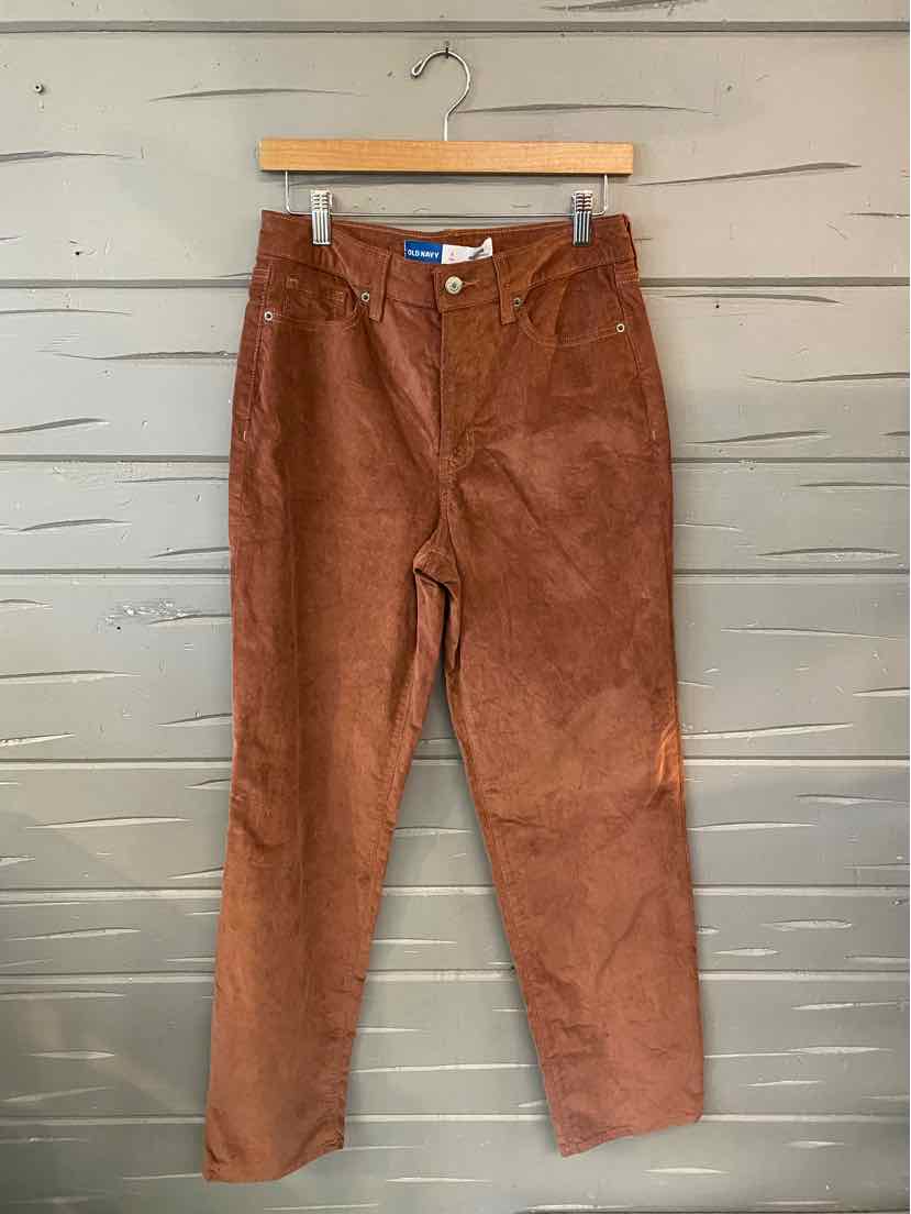 Rust brown corduroy pants for toddlers with front pockets and button closure.