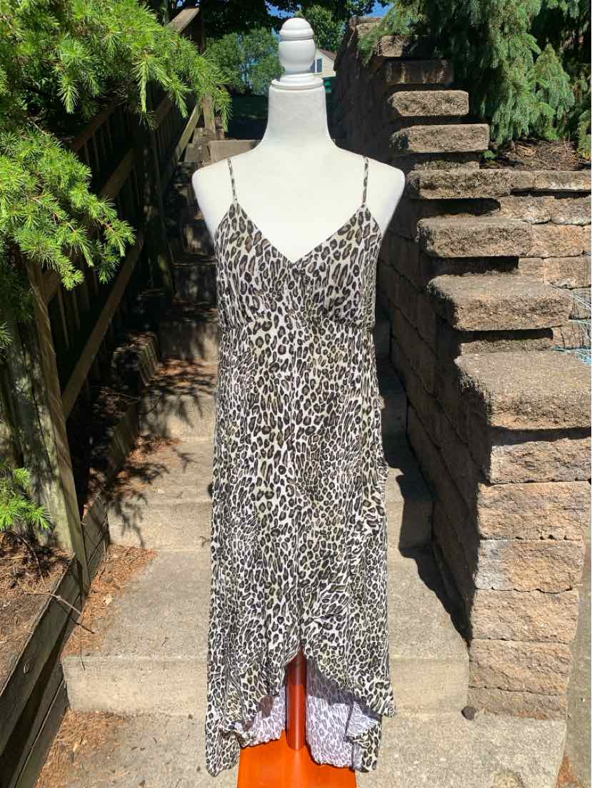 Sleeveless leopard print midi dress with thin spaghetti straps and a V-neckline.
