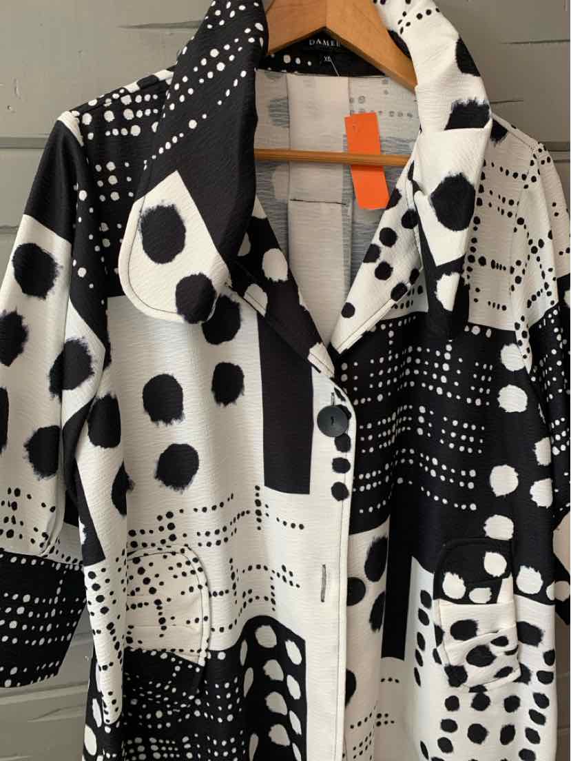 Black and white patterned button-up shirt with mixed polka dots and abstract shapes, size XL.
